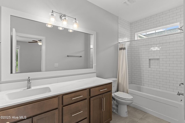 386 Yucca Ln, Wilmington, NC 28412 - bathroom with toilet, vanity, tile patterned flooring, shower / bath combo with shower curtain, and ceiling fan