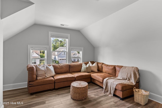386 Yucca Ln, Wilmington, NC 28412 - living area featuring vaulted ceiling, wood finished floors, and baseboards