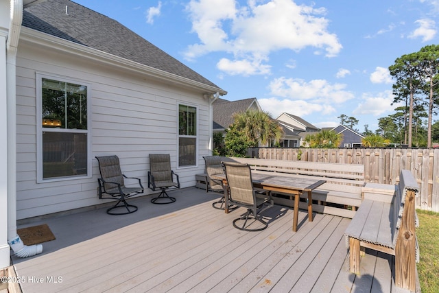 386 Yucca Ln, Wilmington, NC 28412 - wooden deck featuring outdoor dining area
