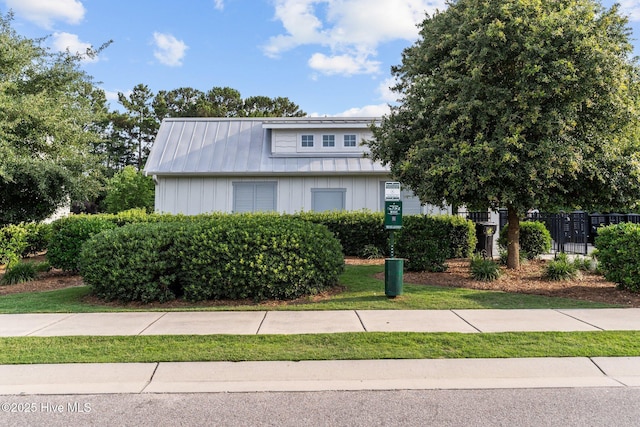 386 Yucca Ln, Wilmington, NC 28412 - view of front of house with board and batten siding and metal roof