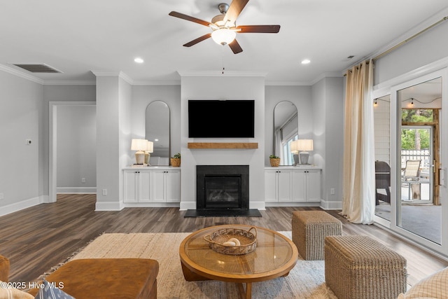 386 Yucca Ln, Wilmington, NC 28412 - living area with a ceiling fan, wood finished floors, ornamental molding, a glass covered fireplace, and baseboards