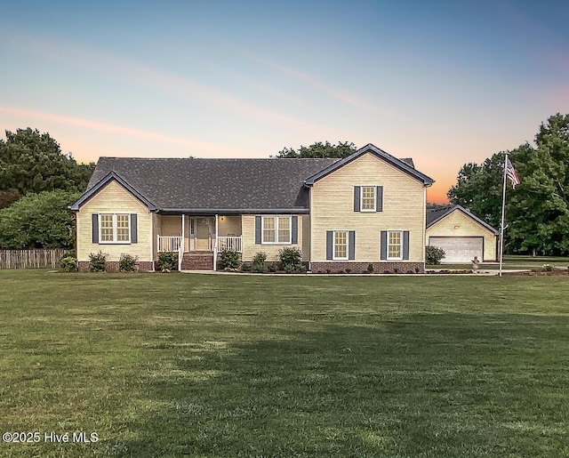813 Puddin Ridge Rd, Moyock, NC 27958 - view of front facade featuring a porch, a detached garage, crawl space, and roof with shingles