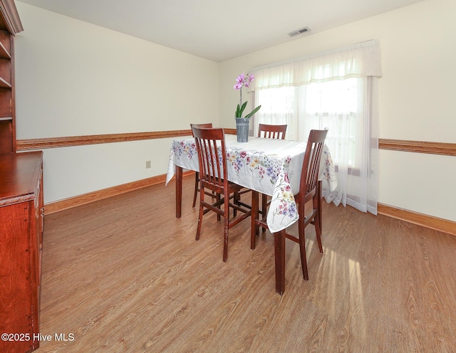813 Puddin Ridge Rd, Moyock, NC 27958 - dining space featuring light wood-type flooring and baseboards