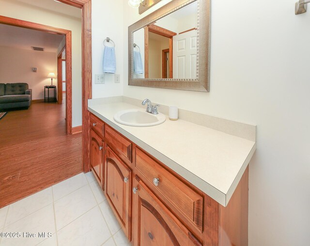 813 Puddin Ridge Rd, Moyock, NC 27958 - bathroom with vanity, tile patterned floors, and baseboards