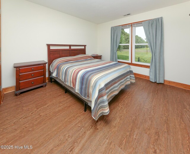 813 Puddin Ridge Rd, Moyock, NC 27958 - bedroom featuring wood finished floors and baseboards