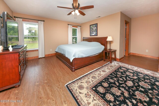 813 Puddin Ridge Rd, Moyock, NC 27958 - bedroom featuring wood finished floors, baseboards, and ceiling fan
