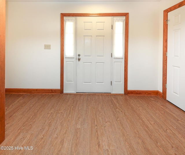 813 Puddin Ridge Rd, Moyock, NC 27958 - entryway featuring baseboards and light wood finished floors