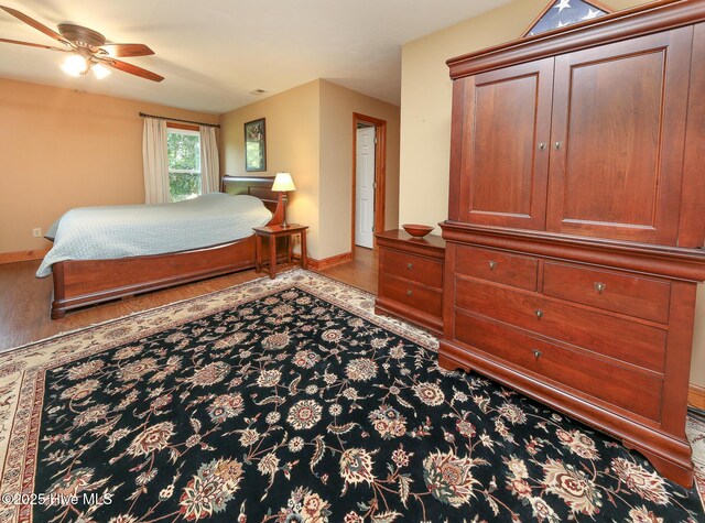 813 Puddin Ridge Rd, Moyock, NC 27958 - bedroom with baseboards, wood finished floors, and ceiling fan