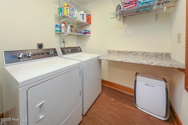 813 Puddin Ridge Rd, Moyock, NC 27958 - washroom with wood finished floors, washer and dryer, and baseboards