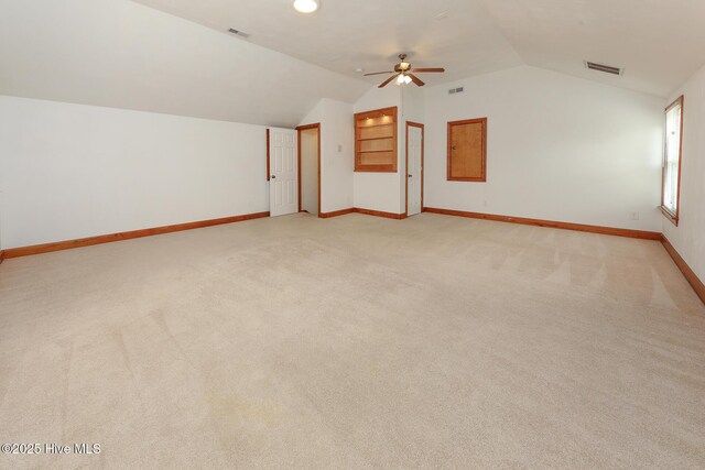 813 Puddin Ridge Rd, Moyock, NC 27958 - additional living space featuring vaulted ceiling, baseboards, a ceiling fan, and light carpet