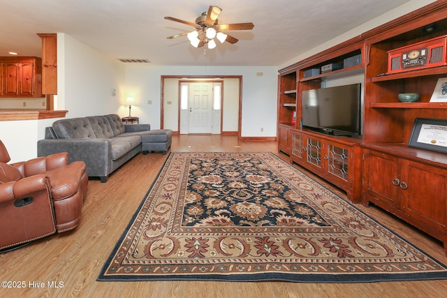 813 Puddin Ridge Rd, Moyock, NC 27958 - living room featuring a ceiling fan and wood finished floors