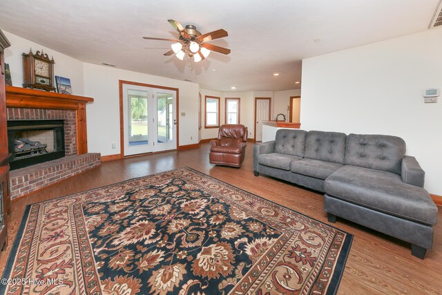 813 Puddin Ridge Rd, Moyock, NC 27958 - living area with wood finished floors, ceiling fan, a fireplace, recessed lighting, and baseboards