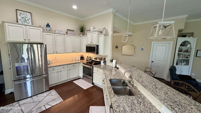 308 E Dolphin Vw, Sneads Ferry, NC 28460 - kitchen with stainless steel appliances, a sink, a peninsula, crown molding, and backsplash