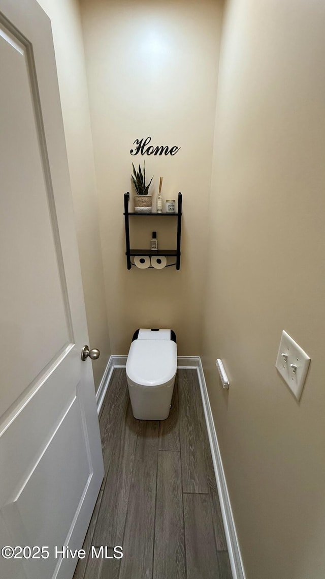 308 E Dolphin Vw, Sneads Ferry, NC 28460 - bathroom featuring baseboards, wood finished floors, and toilet