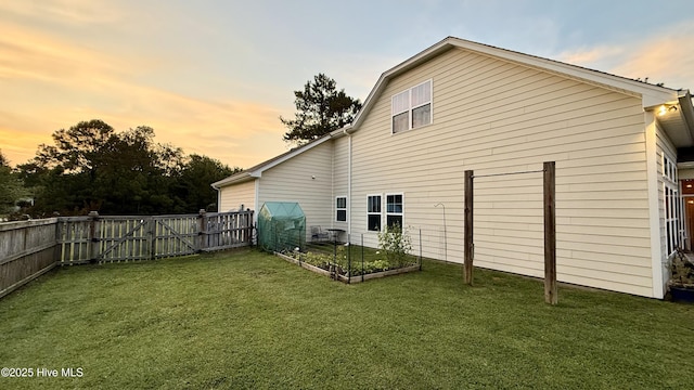 308 E Dolphin Vw, Sneads Ferry, NC 28460 - rear view of property featuring a garden