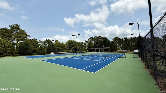 308 E Dolphin Vw, Sneads Ferry, NC 28460 - view of tennis court with community basketball court and view of wooded area