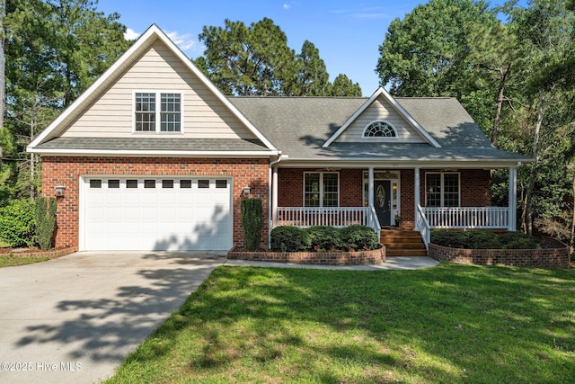 103 Sandspur Ln, West End, NC 27376 - view of front of property featuring concrete driveway, a front yard, a garage, covered porch, and brick siding