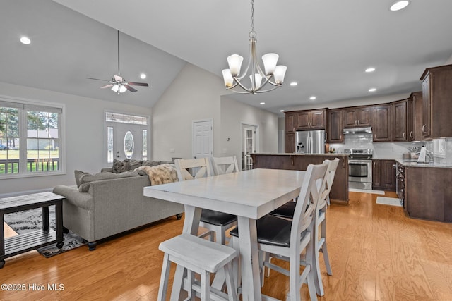 103 Sandspur Ln, West End, NC 27376 - dining room featuring recessed lighting, light wood-type flooring, a chandelier, ceiling fan, and high vaulted ceiling