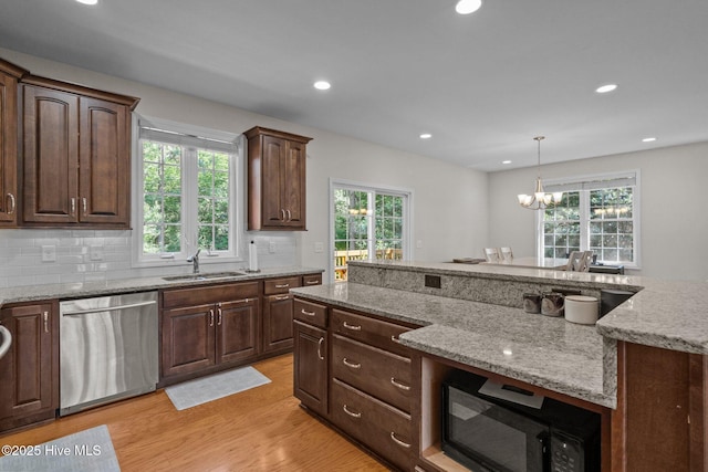 103 Sandspur Ln, West End, NC 27376 - kitchen with dishwasher, a sink, light wood-style floors, a chandelier, and recessed lighting