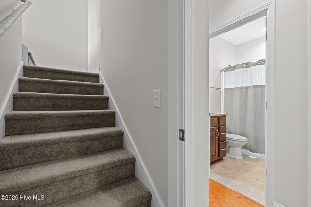 103 Sandspur Ln, West End, NC 27376 - stairs with wood finished floors