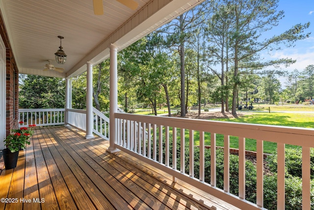 103 Sandspur Ln, West End, NC 27376 - porch with a ceiling fan and view of wooded area