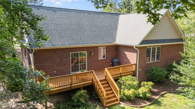 103 Sandspur Ln, West End, NC 27376 - back of house featuring a wooden deck, brick siding, a shingled roof, and stairs
