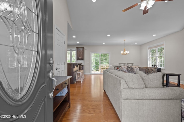 103 Sandspur Ln, West End, NC 27376 - living room with light wood-type flooring, recessed lighting, plenty of natural light, a ceiling fan, and a chandelier