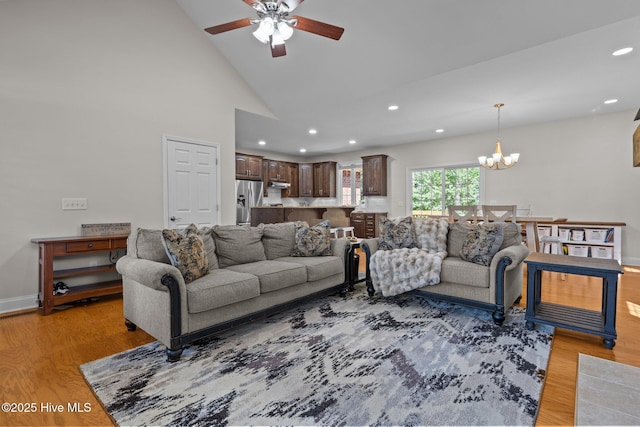 103 Sandspur Ln, West End, NC 27376 - living area with a ceiling fan, a chandelier, recessed lighting, light wood finished floors, and vaulted ceiling