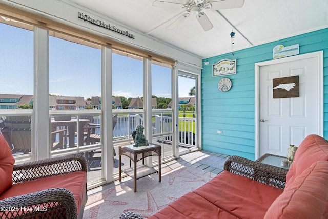 632 Settlers Ln, Kure Beach, NC 28449 - sunroom featuring ceiling fan and a residential view