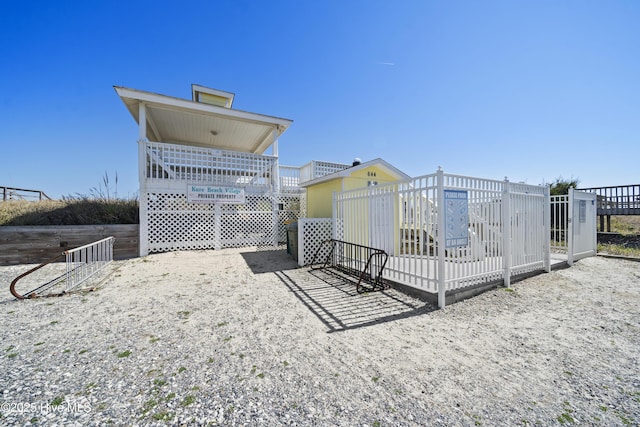 632 Settlers Ln, Kure Beach, NC 28449 - surrounding community with a wooden deck