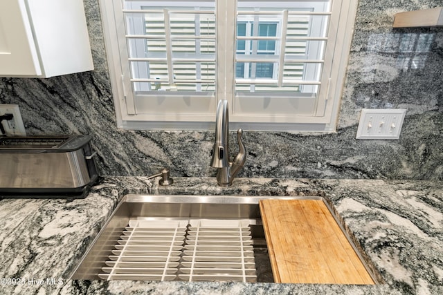 632 Settlers Ln, Kure Beach, NC 28449 - kitchen view of decorative backsplash and white cabinets