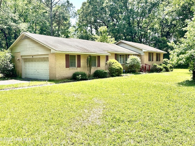 2513 David Ave, Kinston, NC 28501 - ranch-style home with an attached garage, brick siding, a front lawn, and driveway