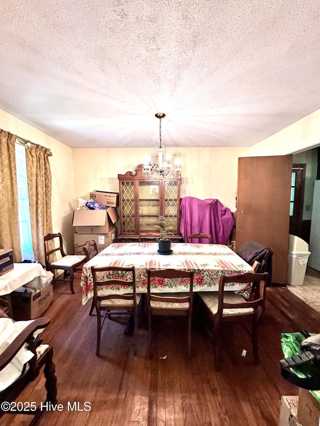 2513 David Ave, Kinston, NC 28501 - dining space with a chandelier, a textured ceiling, and hardwood / wood-style floors