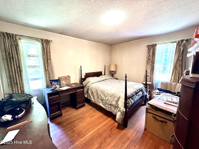 2513 David Ave, Kinston, NC 28501 - bedroom featuring a textured ceiling and light wood-style flooring