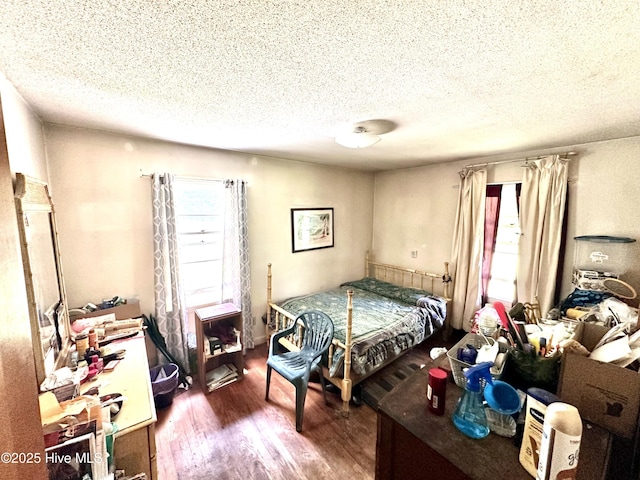 2513 David Ave, Kinston, NC 28501 - bedroom featuring a textured ceiling and wood finished floors