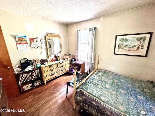 2513 David Ave, Kinston, NC 28501 - bedroom with dark wood-style floors and a textured ceiling