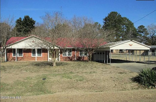 527 Potts Rd, Dudley, NC 28333 - single story home featuring a carport, driveway, a front yard, and brick siding