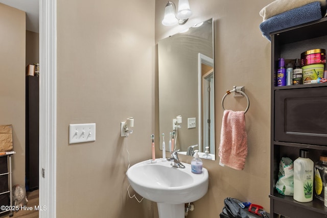40 Sedgefield Ln, Spring Lake, NC 28390 - bathroom with a sink and wood finished floors
