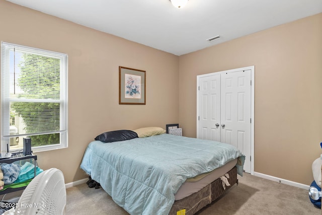 40 Sedgefield Ln, Spring Lake, NC 28390 - carpeted bedroom with multiple windows, baseboards, and a closet