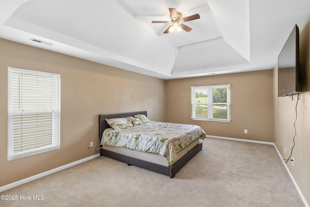 40 Sedgefield Ln, Spring Lake, NC 28390 - bedroom featuring a raised ceiling, carpet floors, and baseboards