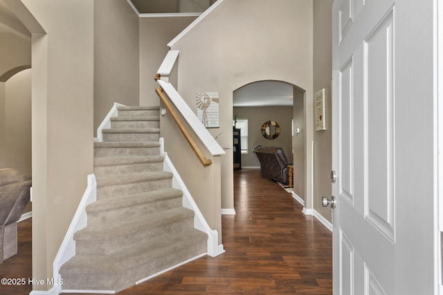 40 Sedgefield Ln, Spring Lake, NC 28390 - entrance foyer featuring arched walkways, wood finished floors, stairs, and baseboards