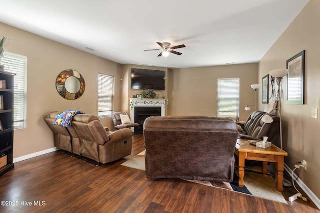 40 Sedgefield Ln, Spring Lake, NC 28390 - living area featuring dark wood-type flooring, ceiling fan, a fireplace, and baseboards