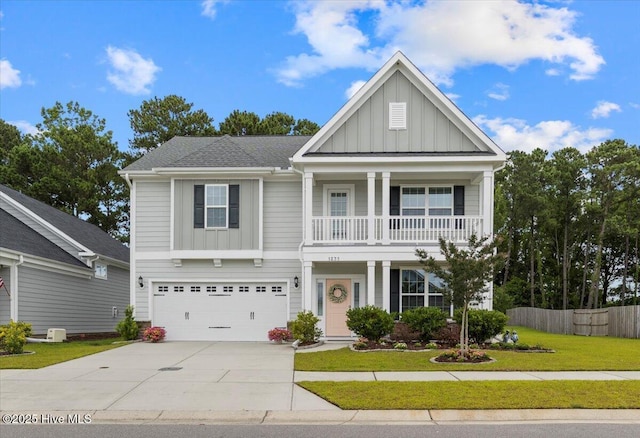 1233 Lt Congleton Rd, Wilmington, NC 28409 - neoclassical / greek revival house with board and batten siding, driveway, a garage, and covered porch