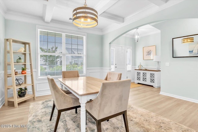 1233 Lt Congleton Rd, Wilmington, NC 28409 - dining room featuring arched walkways, a chandelier, light wood finished floors, beamed ceiling, and coffered ceiling
