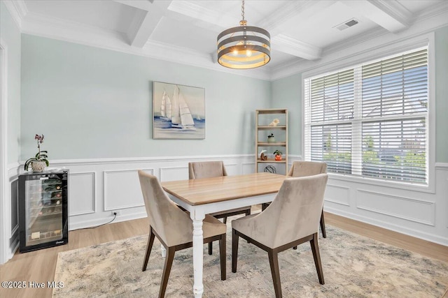1233 Lt Congleton Rd, Wilmington, NC 28409 - dining space featuring wine cooler, coffered ceiling, a chandelier, light wood-style flooring, and healthy amount of natural light