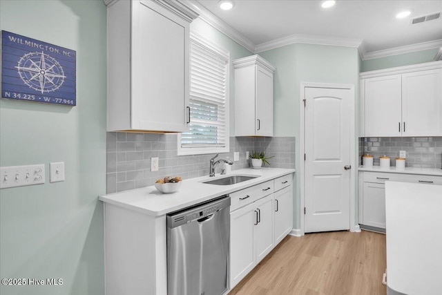 1233 Lt Congleton Rd, Wilmington, NC 28409 - kitchen featuring stainless steel dishwasher, a sink, light countertops, light wood finished floors, and ornamental molding