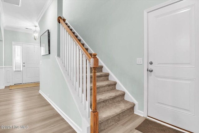 1233 Lt Congleton Rd, Wilmington, NC 28409 - stairway with wood finished floors and crown molding