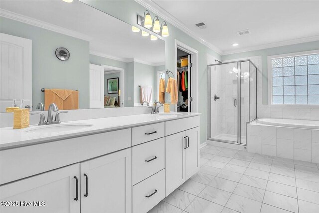 1233 Lt Congleton Rd, Wilmington, NC 28409 - full bathroom featuring double vanity, a stall shower, a garden tub, recessed lighting, and marble finish floors