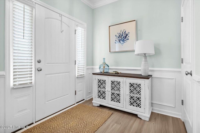 1233 Lt Congleton Rd, Wilmington, NC 28409 - foyer entrance featuring a wainscoted wall, wood finished floors, and crown molding