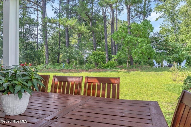 1233 Lt Congleton Rd, Wilmington, NC 28409 - wooden terrace with a yard, view of wooded area, and a fire pit